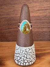 Load image into Gallery viewer, Ring with a turquoise stone on a wooden surface